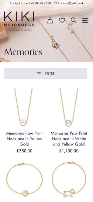 KIKI McDonough jewelry mobile website view with paw print necklaces displayed.