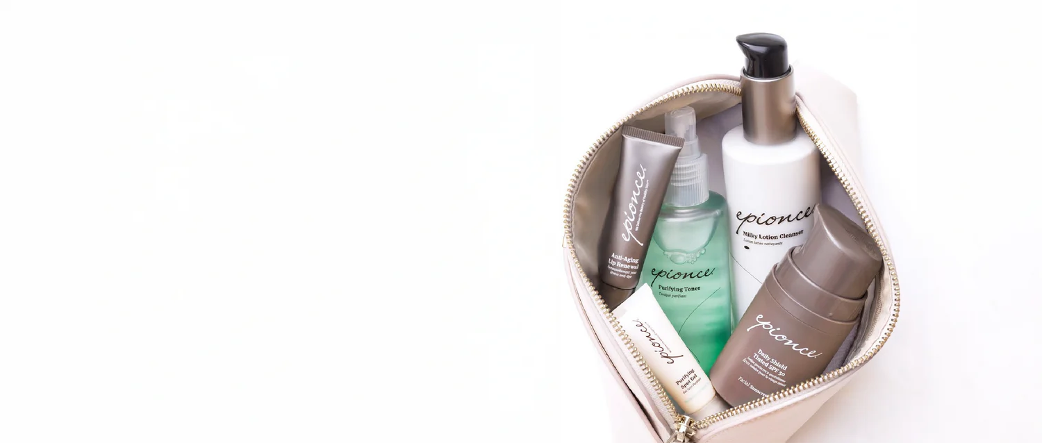 Heart-shaped pouch with skincare products on a white background